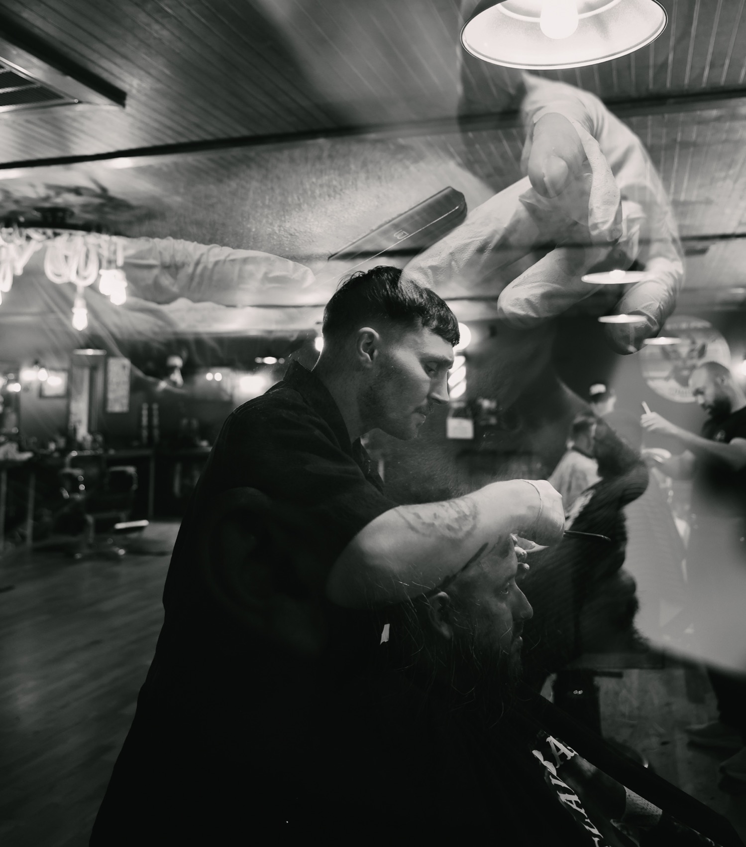 An artistic haircut moment inside Outlaw Barber Company Goose Creek