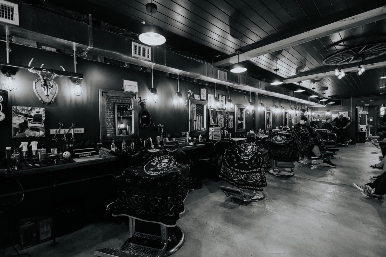 The interior and barber chairs at Outlaw Barber Company Summerville